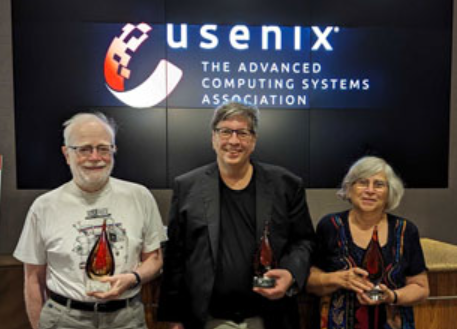 Matt Blaze, center, with Susan Landau, right, and Steven M. Bellovin at the awards ceremony. 