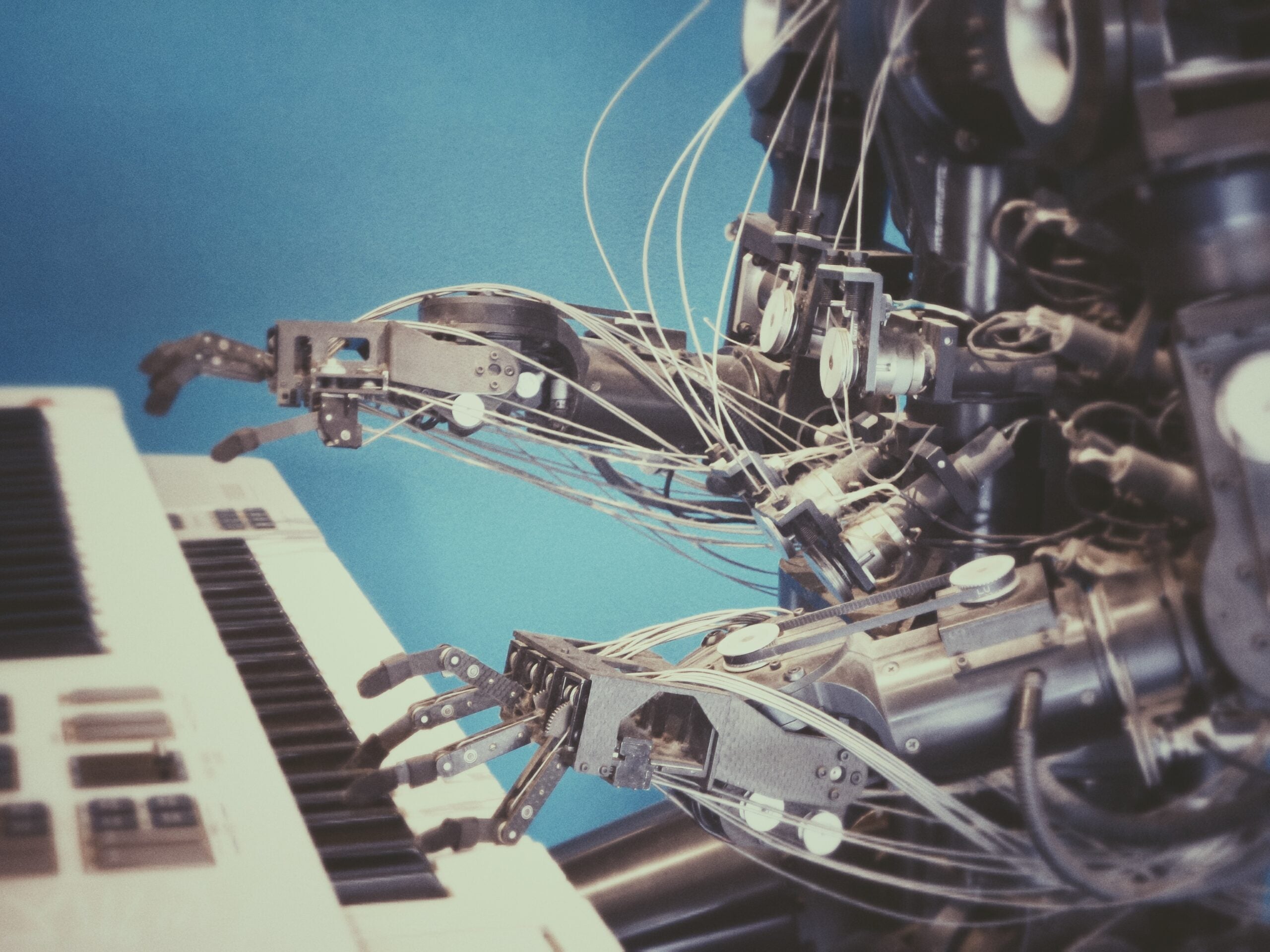 A human-like robot plays a keyboard
